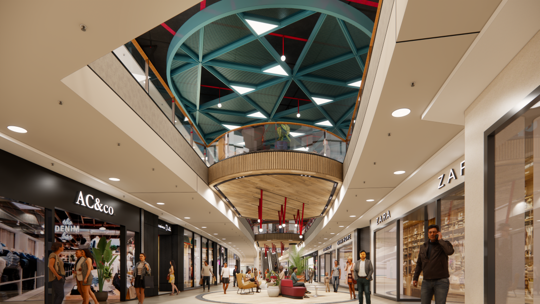 Das Innere eines Shopping-Centers mit diversen Geschäften und Menschen